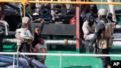 Armed forces stand onboard the Turkish oil tanker 'El Hiblu 1', which was hijacked by migrants, in Valletta, Malta, Thursday March 28, 2019. 