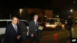 FILE - In this Jan. 9, 2015 photo, U.N. Special Envoy to Libya Bernardino Leon, center, arrives in Tripoli for meetings. 