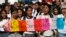 Students hold a sign that reads in Spanish "It's not three, it's all of us" during a protest against the murder of three film students who have become emblematic of Mexico's missing, in Guadalajara, Mexico, April 26, 2018. 