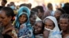 FILE - Ethiopian refugees line up for supplies at the Um Rakouba refugee camp, which houses refugees fleeing the fighting in the Tigray region, on the Sudan-Ethiopia border in Sudan, Nov. 29, 2020. 