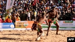 Wrestlers fight during semi-final of the National Sabre, a traditional wrestling competition in Agadez, Niger, on Dec. 31, 2023.