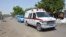 FILE - An ambulance and security vehicles are seen driving to the site of a June 2, 2015, suicide bomb attack in Maiduguri, Nigeria.