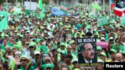 People march during a protest against corruption and the Brazilian conglomerate Odebrecht SA, in Santo Domingo, Dominican Republic, July 16, 2017. The sign reads "Wanted corrupt senior."