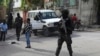 FILE - Police stand guard outside the electoral council headquarters in Port-au-Prince, Haiti, May 31, 2024. Haiti created a provisional electoral council on Sept. 18, 2024, to prepare for its first general elections since 2016. Haiti has not had a president since July 2021.