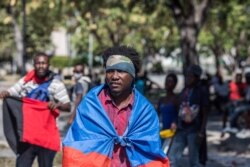 Manifestantes se reúnen el 7 de febrero de 2021 en Port-au-Prince, Haití para exigir la renuncia del presidente Jovenel Moïse, quien busca extender su mandato hasta febrero de 2022, que según la constitución finaliza este 7 de febrero.