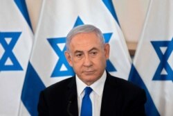 FILE - Israeli Prime Minister Benjamin Netanyahu looks on during a briefing at Hakirya military base in Tel Aviv, May 19, 2021.