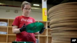 Tannika Benjamin inspects a vinyl record at the United Record Pressing plant July 11, 2024, in Nashville, Tenn.