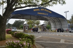 FILE - The main gate at Naval Air Station Pensacola is seen on Navy Boulevard in Pensacola, Florida, March 16, 2016.