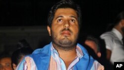 FILE - Turkish-Iranian businessman Reza Zarrab, who is charged in the U.S. for evading sanctions on Iran, watches a concert in Istanbul, Sept. 8, 2013.