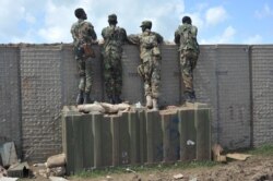 FILE - Somali soldiers are on patrol at the Sanguuni military base, about 450 km south of Mogadishu, Somalia, on June 13, 2018.