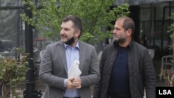 Andi Bushati, left, and Armand Shkullaku, co-owners and managing editors of Albanian news website Lapsi. (LSA photo)