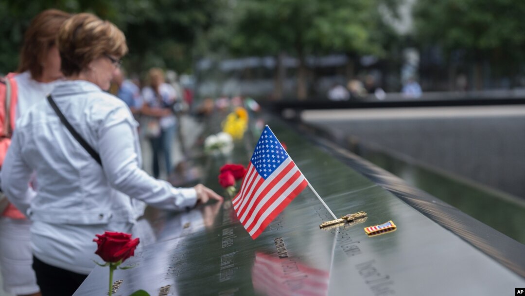 Visitors touch the names of the victims of the Sept. 11, 2001, terror attacks at New York's National September 11 Memorial, Sept. 11, 2015. Survivors and relatives of the nearly 3,000 people killed in the attacks might be able to soon sue Saudi Arabia for damages.