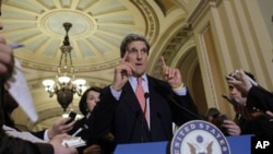 Sen. John Kerry, D-Mass., center, speaks as Sen. Dianne Feinstein, D-Calif., left, listens after an unusual closed Senate session in the Old Senate Chamber on Capitol Hill in Washington Monday, Dec. 20, 2010.