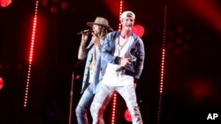 FILE - (L-R) Brian Kelley and Tyler Hubbard of Florida Georgia Line perform at the 2017 CMA Music Festival at Nissan Stadium on June 10, 2017 in Nashville, Tenn.