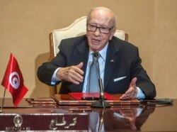 FILE - Tunisian President Beji Caid Essebsi gestures during a press conference in Tunis, Oct. 25, 2018.