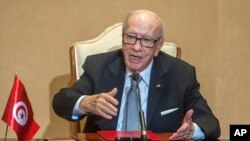 FILE - Tunisian President Beji Caid Essebsi gestures during a press conference in Tunis, Oct. 25, 2018.