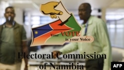 Workers stand inside the premises of the Electoral Commission of Namibia following the country’s general election in Windhoek on Nov. 28, 2024.