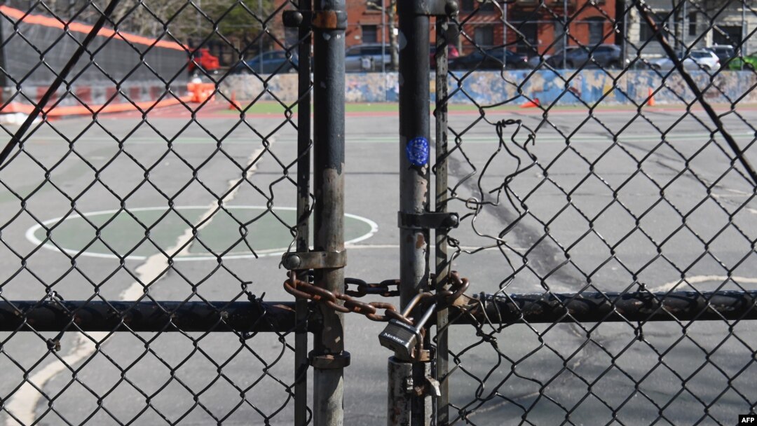 The gate at Public School 39 is closed with a lock on March 16, 2020 in the Brooklyn Borough of New York City. Mayor Bill de Blasio said on July 31, 2020, that NYC schools hope to reopen in September.