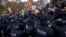 Catalan regional police officers scuffle with protesters in front of the Museum of Leida after police entered the museum to carry out an order and return over 40 contested artworks to the Spanish region of Aragon following a protracted legal battle in Lleida, Spain, Dec. 11, 2017. 