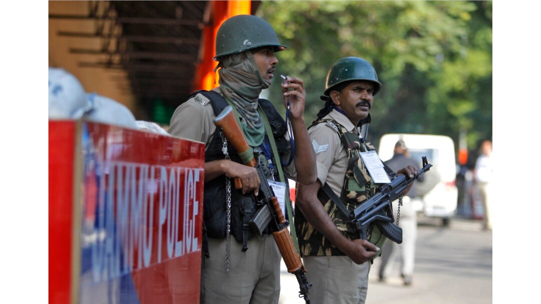 FILE - Indian security personnel guard outside the civil secretariat of the Union territory of Jammu and Kashmir during the annual reopening of the former state's winter capital in Jammu, India, Nov. 4, 2019.