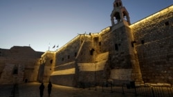 Nuns walk along the Church of the Nativity, traditionally believed to be the birthplace of Jesus, on Christmas Eve, in the West Bank city of Bethlehem, Dec. 24, 2024. 