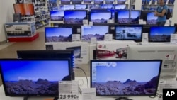 TV sets seen on a shop display on Wednesday afternoon, Aug. 22, 2012 in Moscow Russia.