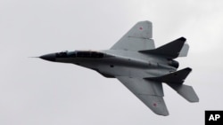 FILE - Russian MIG-29 plane is seen in flight, in Zhukovsky, outside Moscow, Russia, Aug. 11, 2012.