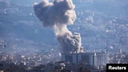 Smoke rises from Beirut southern suburbs after an Israeli strike, amid the ongoing hostilities between Hezbollah and Israeli forces, as seen from Ashrafieh, Lebanon, Nov. 21, 2024.