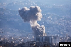 Smoke rises from Beirut southern suburbs after an Israeli strike, amid the ongoing hostilities between Hezbollah and Israeli forces, as seen from Ashrafieh, Lebanon, Nov. 21, 2024.