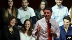 Italian Prime Minister Matteo Renzi talks during a demonstration to support the "Yes" option in the December 4 constitutional referendum, in Rome, Nov. 26, 2016.