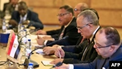 Egyptian Water Resources Minister Mohamed Abdel Aati (2nd R) participates with a delegation in the "Renaissance Dam" trilateral negotiations with his Sudanese and Ethiopian counterparts (unseen) in the Sudanese capital Khartoum, Oct. 4, 2019.