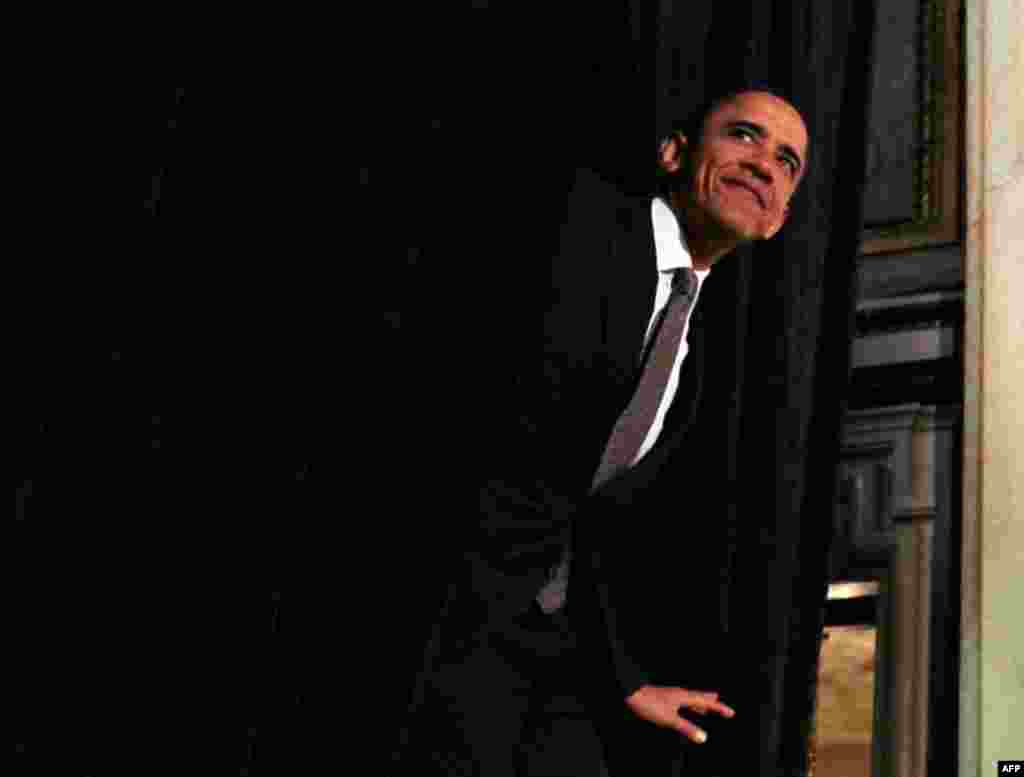 May 12: President Barack Obama steps out from behind a curtain to deliver remarks at the National Hispanic Prayer Breakfast in Washington.(REUTERS/Jim Young)