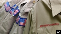 FILE - Boy Scouts of America uniforms are displayed in the retail store at the headquarters for the French Creek Council of the Boy Scouts of America in Summit Township, Pa, Feb. 18, 2020.