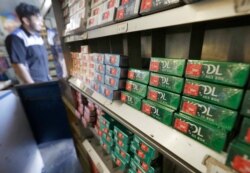 FILE - Packs of menthol cigarettes and other tobacco products line shelves at a store in San Francisco, May 17, 2018.