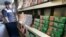 FILE - Packs of menthol cigarettes and other tobacco products line shelves at a store in San Francisco, May 17, 2018.
