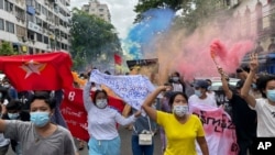 Students protest the February military takeover by the State Administration Council as they march at Kyauktada township in Yangon, Myanmar, on July 7, 2021.