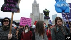 Protesters march demanding greater accessibility of abortion but also for better work conditions and more state support in raising children, Warsaw, Poland, March 6, 2016.