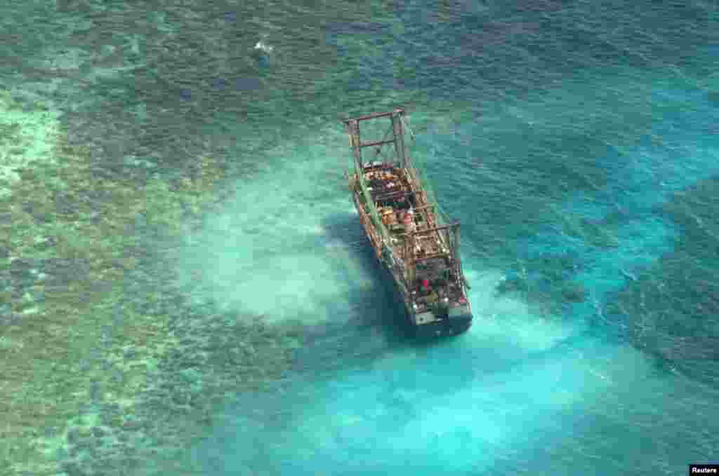 A Chinese fishing vessel that ran aground in Tubbataha Reef, a UNESCO World Heritage site, is pictured in Palawan Province, west of Manila, Philippines. (Picture provided by Naval Forces West)
