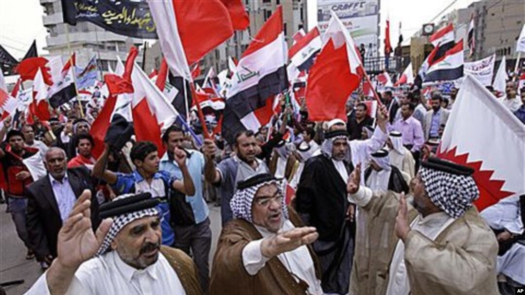 Iraqis chant slogans during a demonstration in solidarity with Bahraini protesters in Baghdad, April 23, 2011