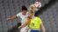 United States' Carli Lloyd, left, and Sweden's Amanda Ilestedt, right, go for a header during a women's soccer match at the 2020 Summer Olympics, July 21, 2021, in Tokyo.