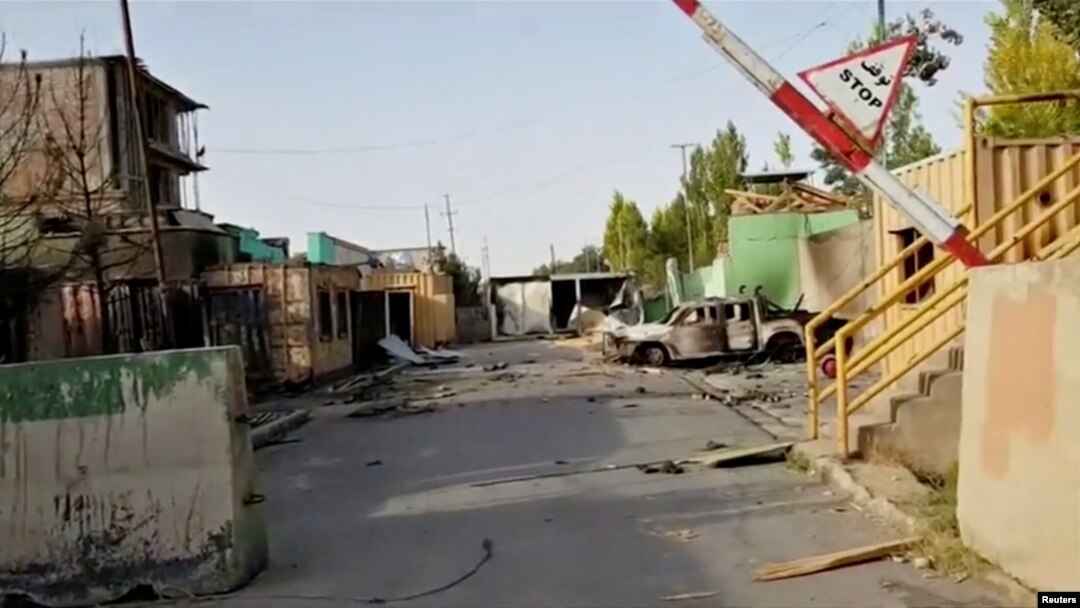 FILE - Damage is seen from a previous attack on a security base in Ghazni City, Afghanistan, in this still image taken from video by Ariana News, Aug. 13, 2018. Taliban insurgents attacked and overran a base outside the provincial capital Saturday. 