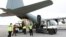 A handout picture released by the World Health Organization (WHO) on March 2, 2020, shows the unloading of medical equipment and coronavirus testing kits upon their arrival at Mehrabad International Airport in Iran's capital Tehran.
