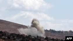 Smoke billows from the site of an Israeli airstrike that targeted an area in the southern Lebanese village of al-Taybeh on Sept. 19, 2024. 