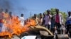 Anti-government protesters burn photographs of President Mohamed Abdullahi Mohamed, also known as Farmajo, in the Fagah area of Mogadishu, Somalia, April 25, 2021. 