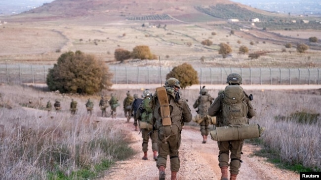 Israeli Paratroopers' Brigade members operate in a location given as the Syrian border, in this handout picture released on Dec. 13, 2024. (Israel Defense Forces/Handout via Reuters)