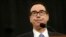 FILE - Treasury Secretary Steven Mnuchin testifies on Capitol Hill in Washington.