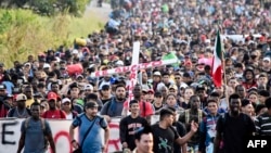 Migrants take part in a caravan towards the border with the United States in Tapachula, Chiapas State, Mexico, on Dec. 24, 2023.