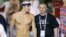 FILE - In this March 2007 file photo, U.S. swimming star Michael Phelps, left, walks with his coach Bob Bowman during a training session at the World Swimming Championships in Melbourne, Australia.