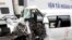 A van is damaged after colliding into a container truck, July 30, 2018, in Quang Nam province, Vietnam. 