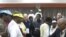 Election officials close the last ballot box at a polling station in Addis Ababa's historic district at the end of voting day, 23 May 2010